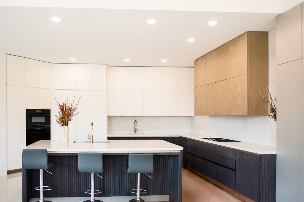 Contemporary kitchen with panel-ready appliances, custom hood, and custom Italian cabinetry