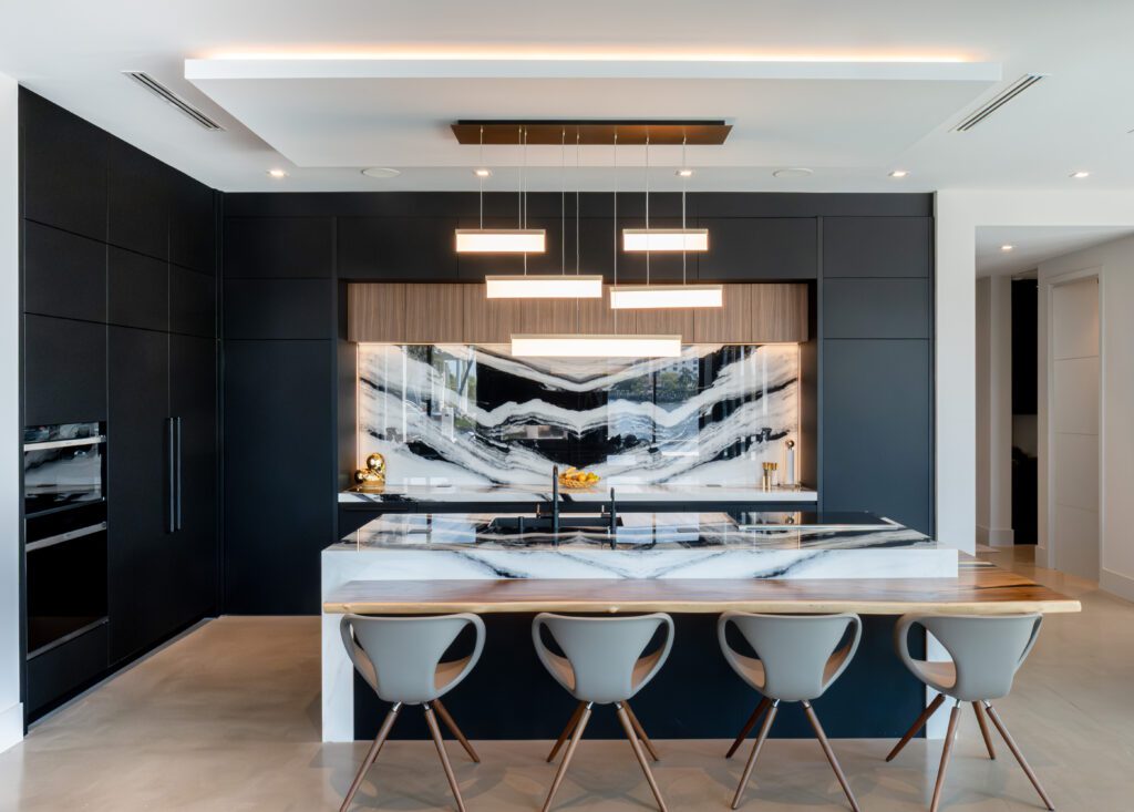 All-Black Modern Kitchen with Panda Marble Backsplash, Giving the All-Black Kitchen Much-Needed Contrast