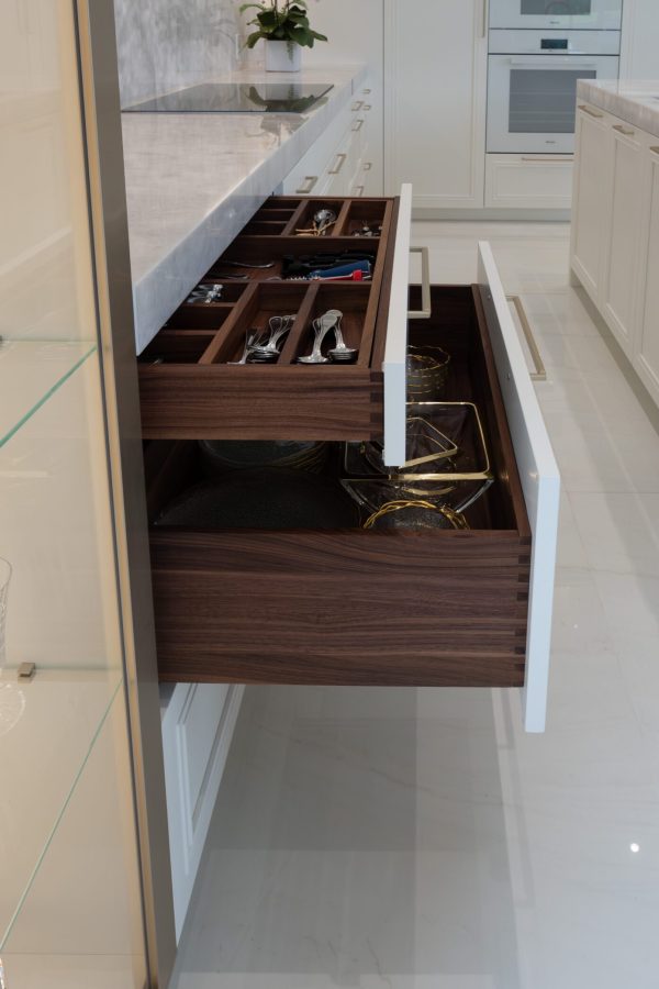 Walnut wooden dovetail drawers with custom dividers.